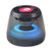 Pacific Magnetic Bluetooth Speaker Stand with RGB LED Light (Stock) - A compact black Bluetooth speaker stand featuring a vibrant RGB LED light and a logo on top.