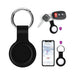Aspen Silicone Airtag Case - A black silicone Airtag case with a metal keyring, displayed alongside keys and a smartphone showing a map.