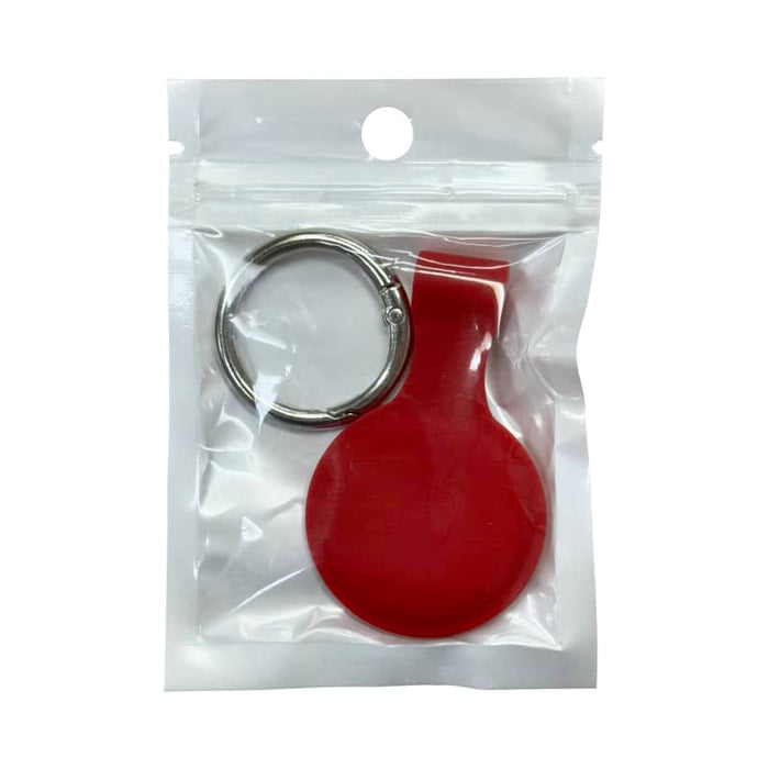 Aspen Silicone Airtag Case - A red silicone Airtag case with a keyring, packaged in a clear plastic bag.