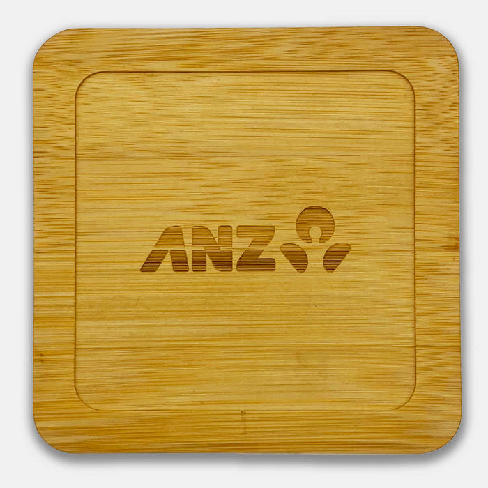 Aroma Coffee Coasters - A bamboo coaster featuring a square shape with a logo engraved in the centre.