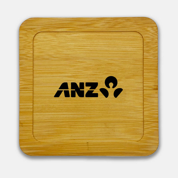 Aroma Coffee Coasters - A bamboo coaster featuring a square shape and a black logo. The surface is smooth and polished.
