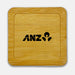 Aroma Coffee Coasters - A bamboo coaster featuring a square shape and a black logo. The surface is smooth and polished.