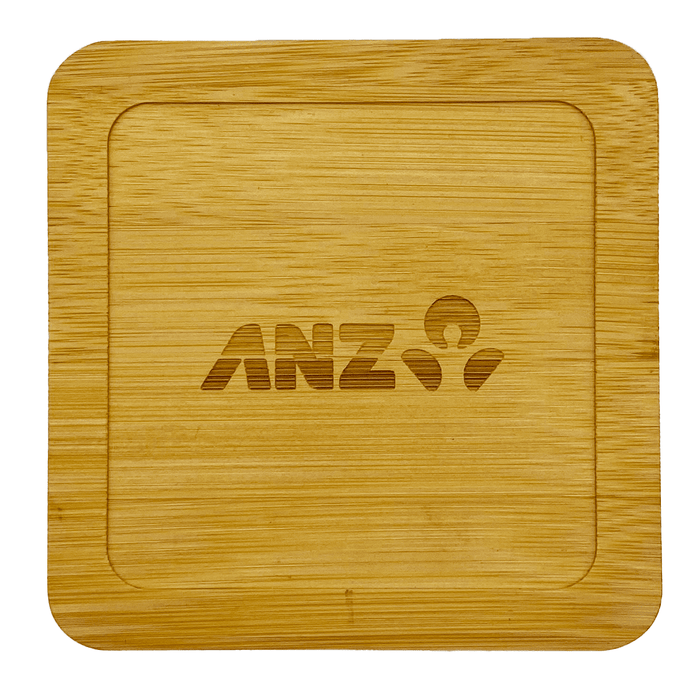 Aroma Coffee Coasters - A bamboo coaster with a square shape, featuring an engraved logo. The colour is light brown.