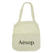 Maglia Cotton Shopping Tote - A light beige cotton shopping tote with a mesh top section and a logo on the front.