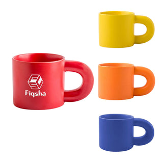 Laser Engraving Ceramic Coffee Mug - A set of four ceramic coffee mugs in red, yellow, orange, and blue, featuring a logo on the red mug.