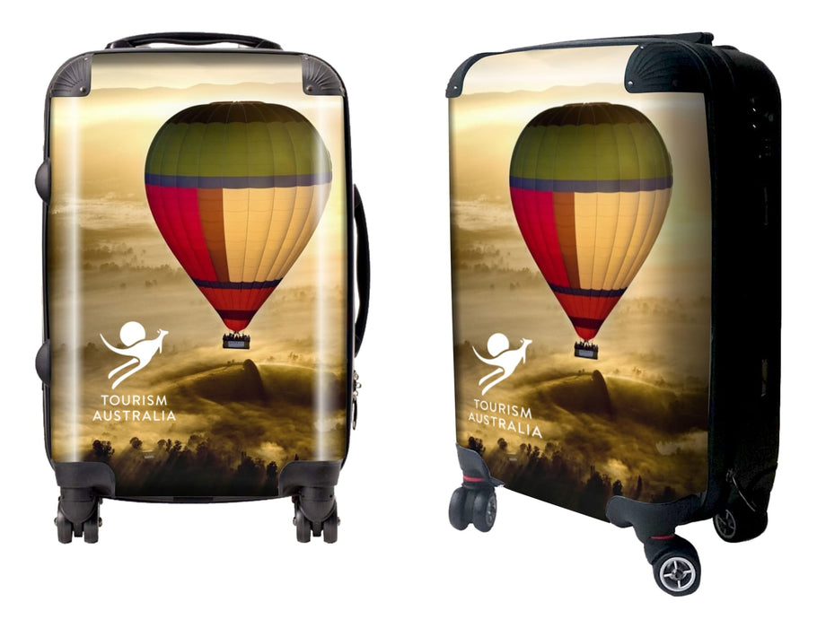Traveller Carry-on Suitcase - A wheeled suitcase features a colourful hot air balloon design and includes a logo. The suitcase is predominantly yellow and red.
