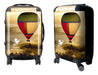 Traveller Carry-on Suitcase - A wheeled suitcase features a colourful hot air balloon design and includes a logo. The suitcase is predominantly yellow and red.
