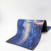 Rubber Desk Mat - A rubber desk mat featuring a blue and grey city skyline design with digital network motifs.