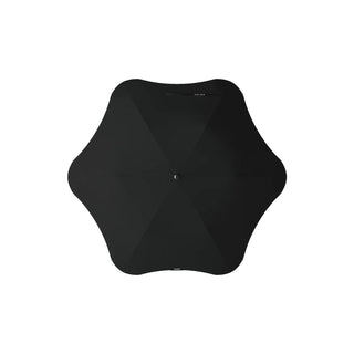 BLUNT Metro Umbrella - A black BLUNT Metro Umbrella with a unique shape and central button. It features a minimalist design.