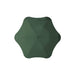 The Blunt Umbrella All Weather Set - A green BLUNT Metro umbrella with a unique octagonal shape and a central button for opening and closing.
