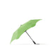 BLUNT Metro Umbrella - A green BLUNT Metro Umbrella with a black handle, showcasing a unique, aerodynamic design.