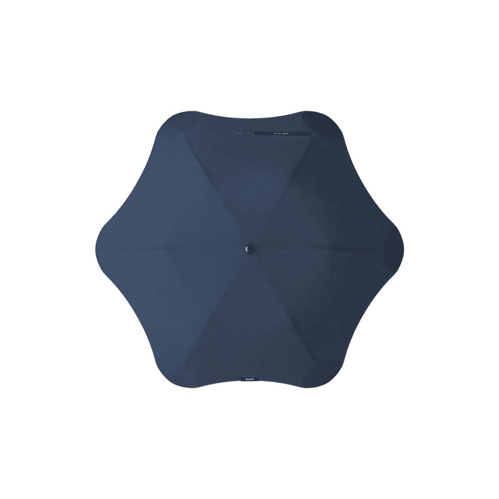 BLUNT Metro Umbrella - A navy BLUNT Metro Umbrella with a unique octagonal shape and a central button, featuring a logo.