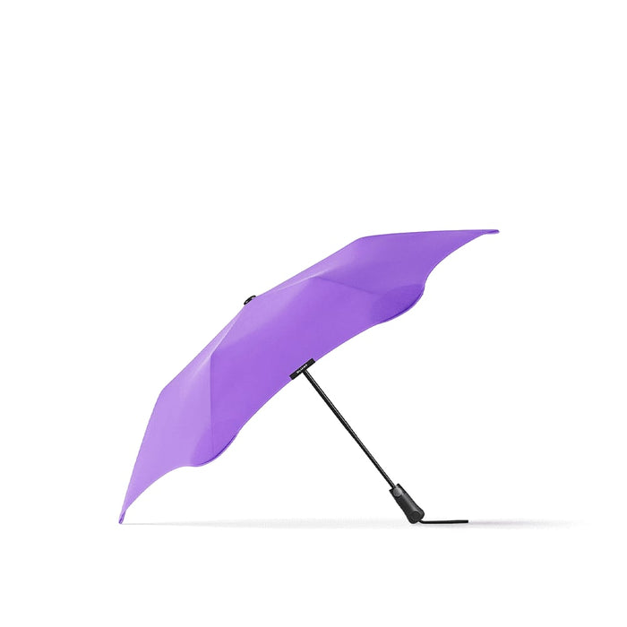 BLUNT Metro Umbrella - A purple BLUNT Metro Umbrella with a black handle, featuring a sleek design and a sturdy support frame.