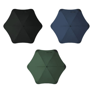 BLUNT Sport Umbrella - A collection of three BLUNT Sport Umbrellas in black, navy, and green, displaying their unique hexagonal shapes.
