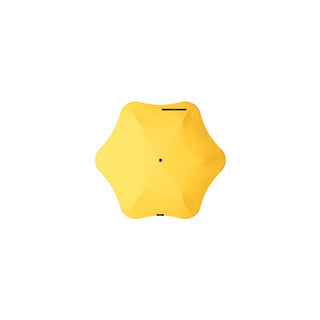 BLUNT Neo Umbrella - A yellow BLUNT Neo Umbrella with a unique star-shaped design and a central black button.