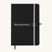 Discovery A5 Notebook - A black A5 notebook with an elastic closure and a logo on the front, featuring a grey band and bookmark.