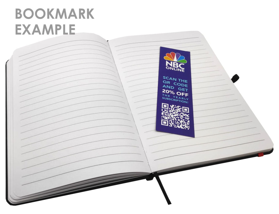 Essentials A5 Notebook - A notepad with blank lined pages and a bookmark inserted, featuring a design with various colours and a logo.