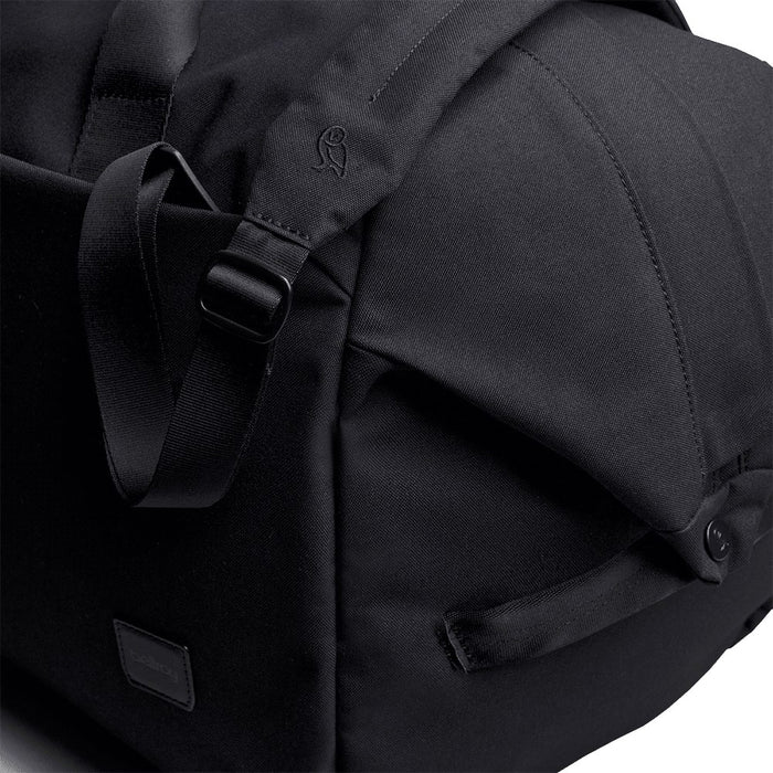 Bellroy Classic Duffel 45L - A black duffel bag featuring adjustable straps and a sleek design, with a logo on the side.