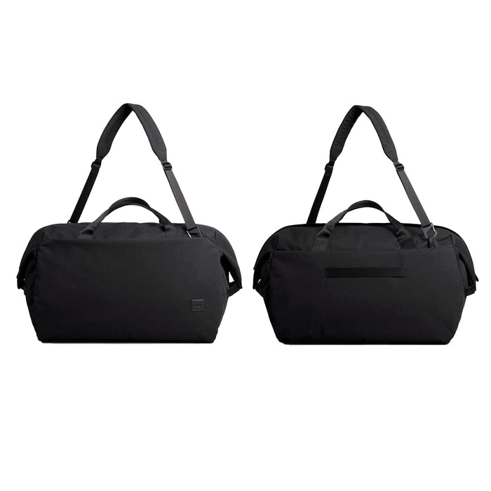 Bellroy Classic Duffel 45L - A black duffel bag with dual handles and an adjustable shoulder strap, featuring a logo on the side.