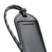 Bellroy Luggage Tag - A black luggage tag with a textured surface and a patterned strap, featuring a branding logo.