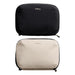 Bellroy Lite Tech Kit - A black and a beige tech kit with zippers, both featuring a logo on the front.