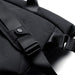 Bellroy Classic Messenger 13L - A black messenger bag featuring adjustable straps and a logo. The material appears textured and durable.
