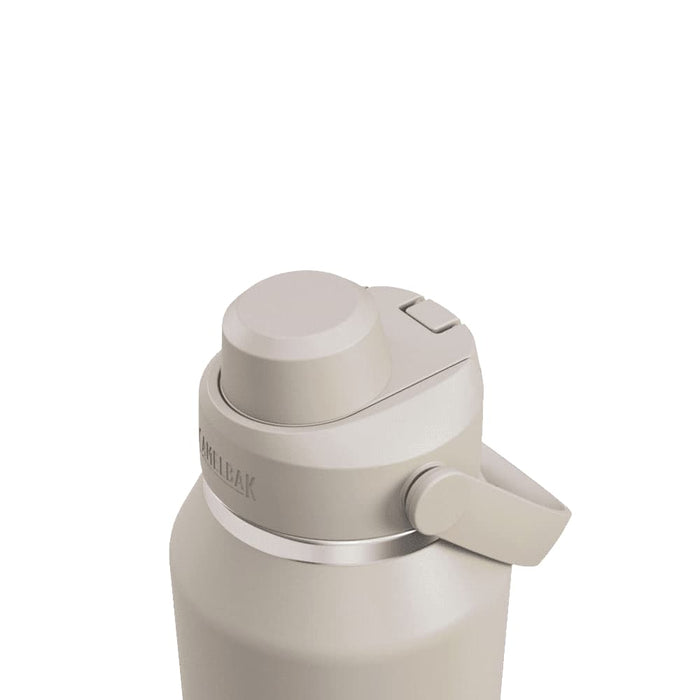 CamelBak - Thrive Chug VSS 1.2L - A drink bottle in a light beige colour with a twist top and a handle, featuring a logo on the side.