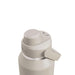 CamelBak - Thrive Chug VSS 1.2L - A drink bottle in a light beige colour with a twist top and a handle, featuring a logo on the side.