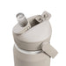 CamelBak - Thrive Flip Straw VSS 0.75L - A drink bottle in a beige colour features a flip straw lid and a side lever for easy opening. It has a logo.