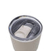 CamelBak - Thrive Tumbler VSS 0.9L - A drink bottle with a stainless steel body and a clear, sealed lid, featuring a logo. Primarily in light beige colour.