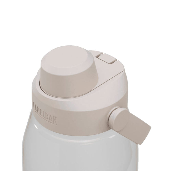 CamelBak - Thrive Chug 1.5L - A drink bottle in a light beige colour with a secure top and a side lever. It features a branding logo.
