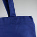 450gsm Hawaiian Canvas Tote Bag - A blue 450gsm Hawaiian canvas tote bag with sturdy handles and a textured finish, featuring a logo.