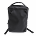 Tessa Soft PU Backpack - A black soft PU backpack with a top handle, zippered front pocket, and adjustable shoulder straps. Features a logo.