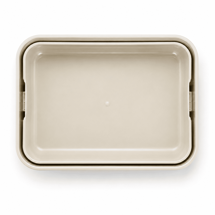 Stack & Go Lunchbox - A light beige rectangular lunchbox with a smooth surface and rounded edges. It features a logo.