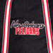 Century Canvas Tote Bag - A black tote bag featuring a logo and red and white striped straps.