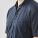 Men's Sonora Short Sleeve Knit Shirt - A navy short sleeve button-up shirt featuring a chest pocket and a logo.