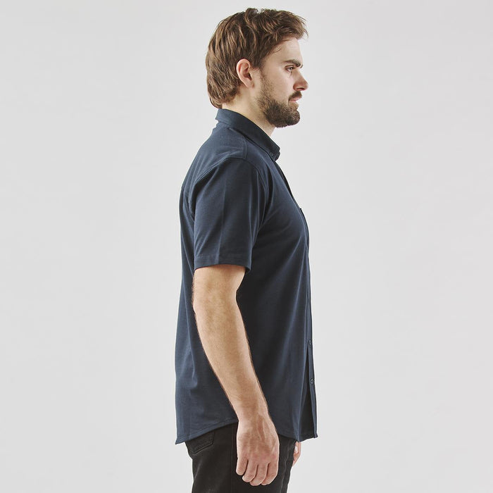Men's Sonora Short Sleeve Knit Shirt - A side view of a navy blue men's short sleeve button-up shirt, featuring a collar and a logo.