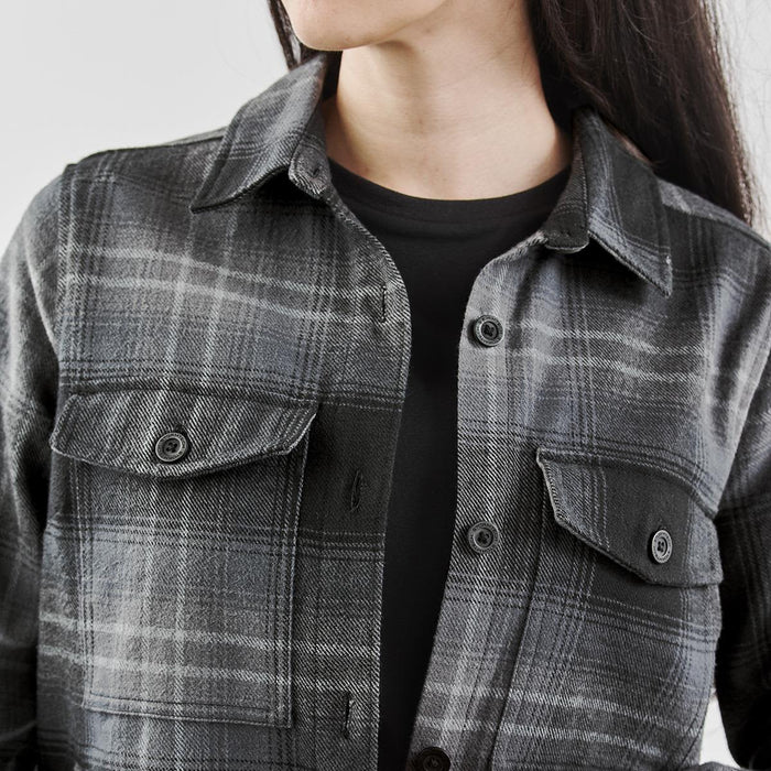 Women's Highland Plaid Shacket - A stylish women's shacket featuring a black and grey Highland plaid pattern with buttoned pockets.