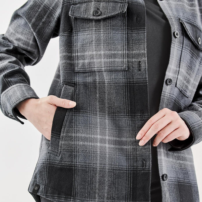 Women's Highland Plaid Shacket - A women's shacket in grey and black Highland plaid with a front pocket and button closure. Features a logo.