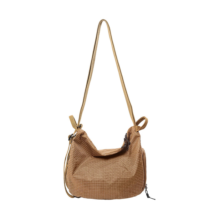 Convertible Lightweight Backpack Duffel Bag - A convertible lightweight backpack duffel bag in a brown checkered pattern with a single adjustable strap.