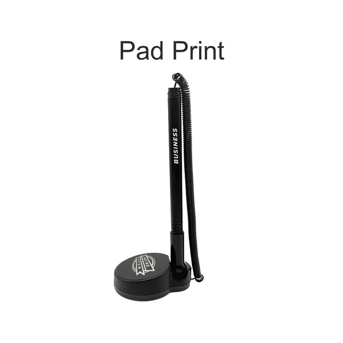 Counter Fixed Signature Pen D - A black fixed signature pen with a coiled cord attached to a round base. The base has a logo.