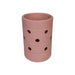 EVA Holes Stubby Holder - A drink bottle holder in a soft pink hue, featuring multiple holes and a smooth texture. It has a branding logo.