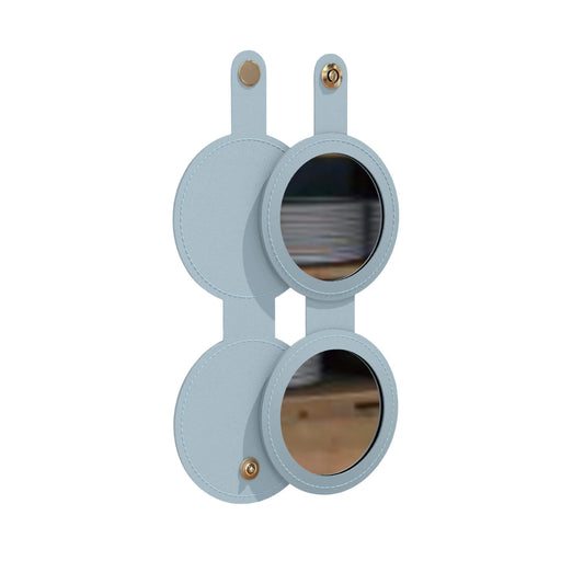 Round Folding Pocket Mirror - A round folding pocket mirror with a soft blue exterior and two reflective surfaces, featuring gold hardware accents.