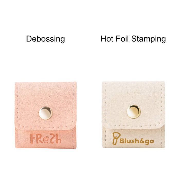 Mini Synthetic Leather Jewellery Bag - A mini synthetic leather jewellery bag in pink with debossing and a cream bag with hot foil stamping, each featuring a snap closure.