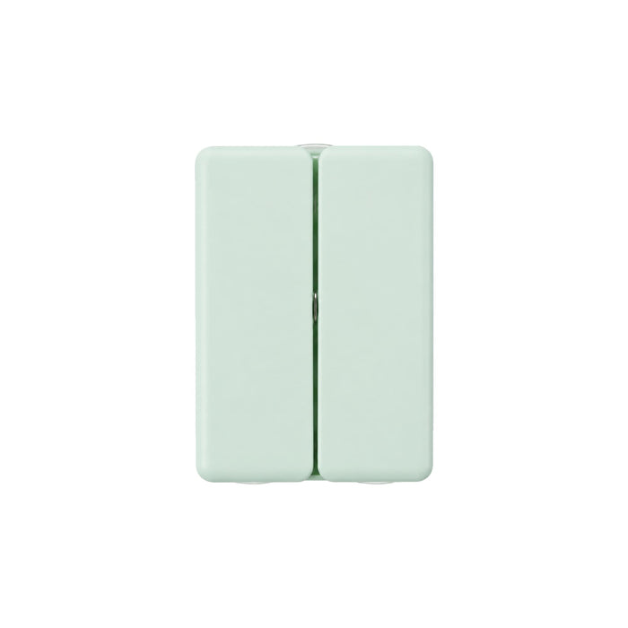 Folding 7 Compartment Pills Box - A pale green folding pill box with seven compartments and a small logo on the surface.