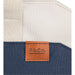Field & Co.® Parks 16" Computer Work Tote - A navy and cream tote bag featuring a leather tag with branding and sturdy woven straps.