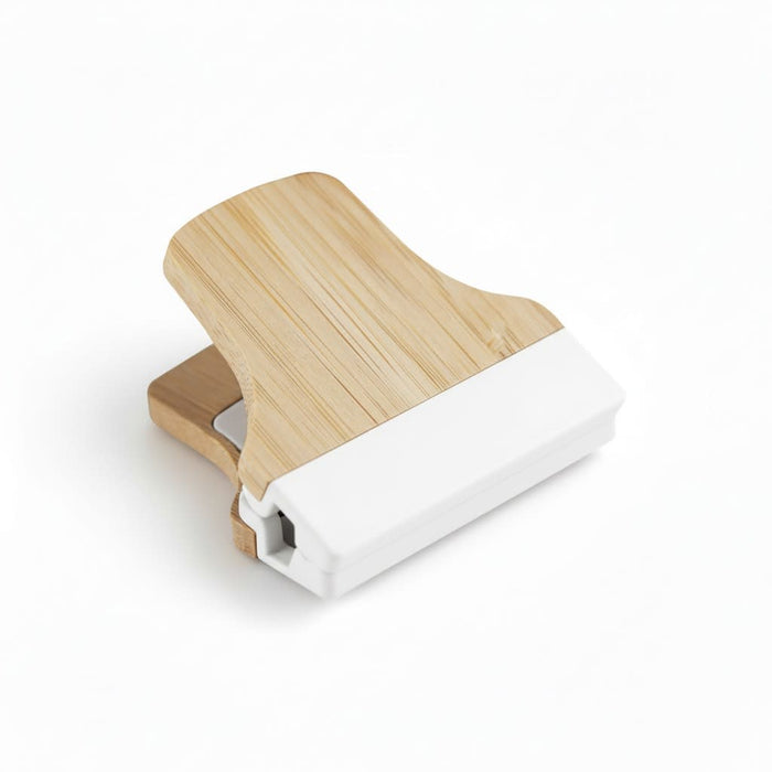 Bamboo Fridge Magnet Clip - A bamboo fridge magnet clip with a natural wood finish and a white base, designed for holding notes or papers.