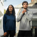 Women's Monterey 1/4 Zip Pullover - A navy blue women's pullover and a grey men's pullover with quarter zip, featuring logos.