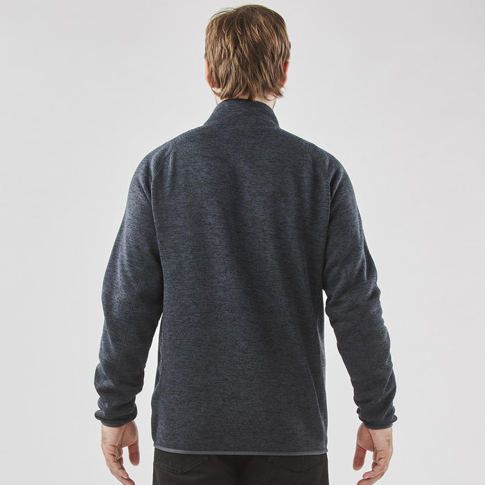 Men's Yosemite Full Zip Fleece Jacket - A men's full zip fleece jacket in dark grey, featuring a simple design and a collar. Branding is visible on the jacket.