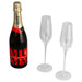 Champagne Flute Gift Set - A champagne bottle in dark glass with two clear champagne flutes. Features a logo on the bottle.